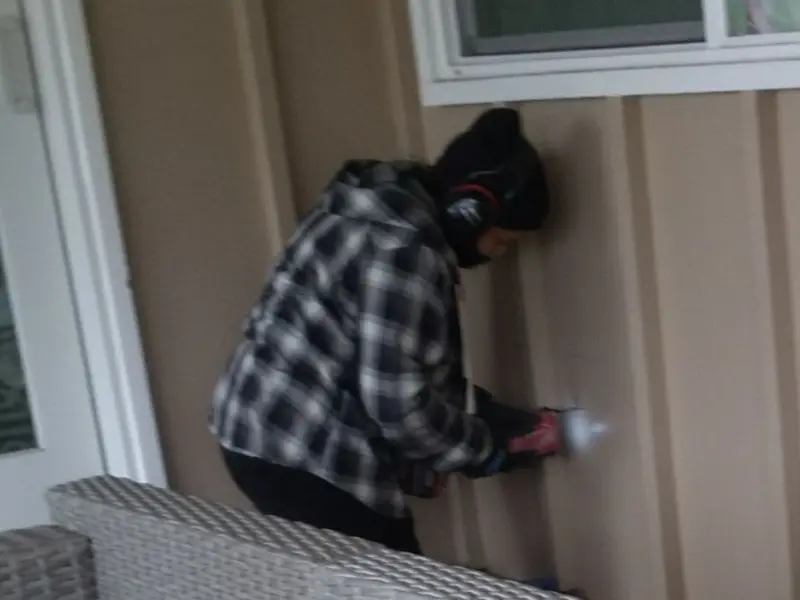 Professional electrician installing an exterior outlet in Gothenburg